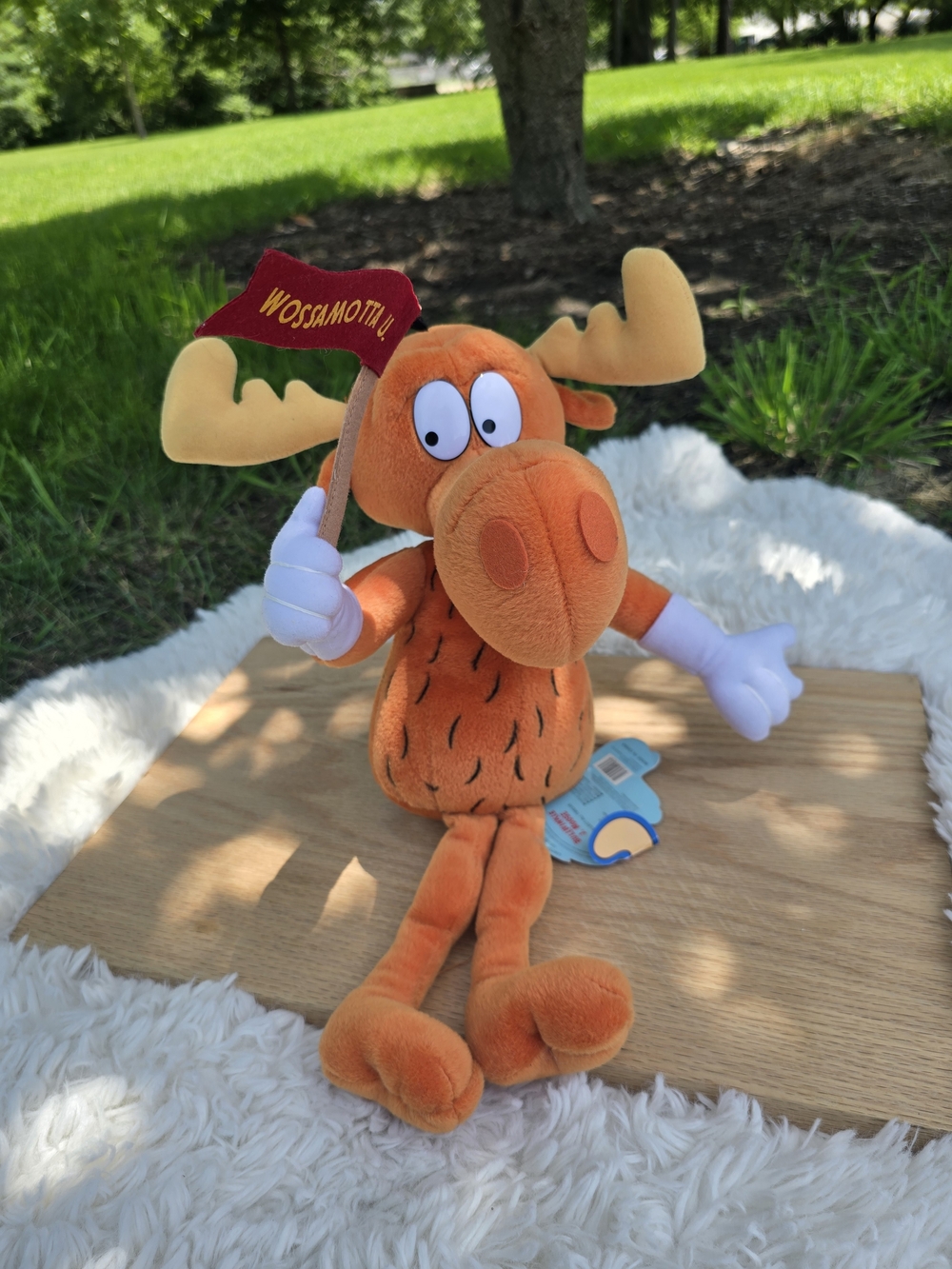 1999 Stuffins brand Bullwinkle J. Moose plush toy holding a "Wossamotta U" flag
